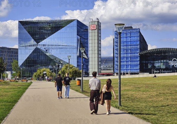 People on their way to Cube Berlin and Berlin Central Station in Spreebogenpark, Germany
