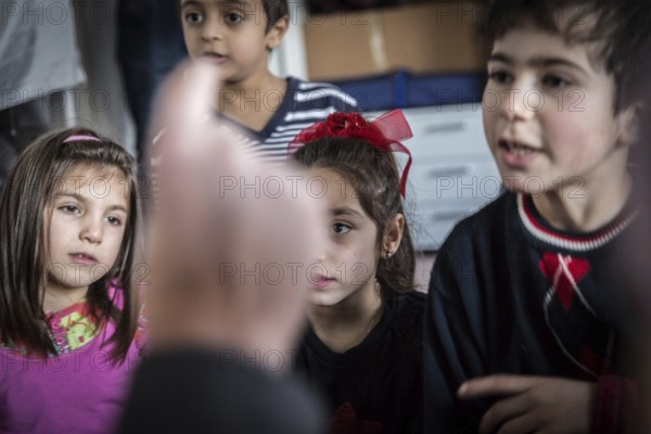 DEU Germany Germany Berlin An animation team entertains refugee children in an asylum center in Berlin