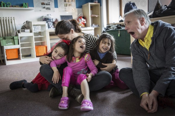 DEU Germany Germany Berlin An animation team entertains refugee children in an asylum center in Berlin