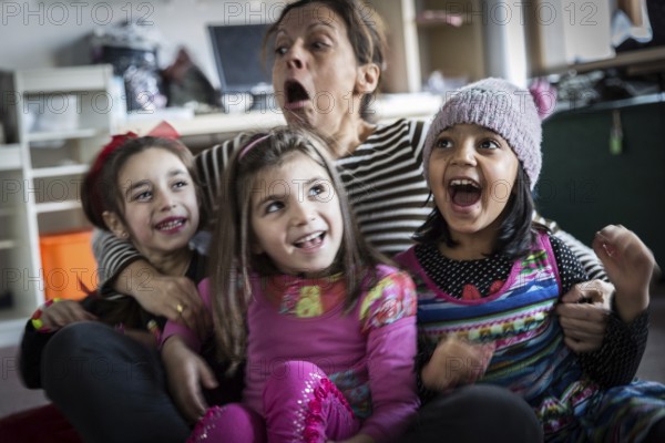 DEU Germany Germany Berlin An animation team entertains refugee children in an asylum center in Berlin