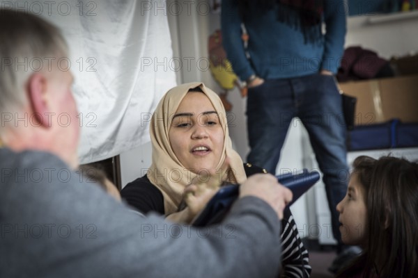 DEU Germany Germany Berlin An animation team entertains refugee children in an asylum center in Berlin
