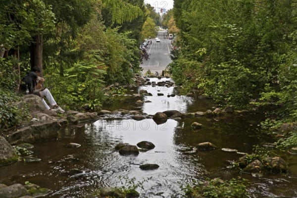 Artificial waterfall in Victoria Park with Großbeerenstraße in the background, Berlin-Kreuzberg, Berlin, Germany