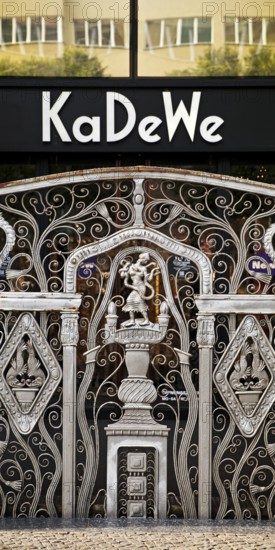 KaDeWe logo, Kaufhaus des Westens, with old forged grid in front of the entrance when the shop is closed, Charlottenburg, Berlin, Germany