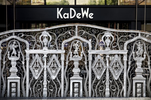 KaDeWe logo, Kaufhaus des Westens, with old forged grid in front of the entrance when the shop is closed, Charlottenburg, Berlin, Germany