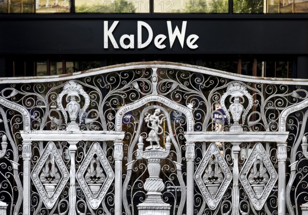 KaDeWe logo, Kaufhaus des Westens, with old forged grid in front of the entrance when the shop is closed, Charlottenburg, Berlin, Germany