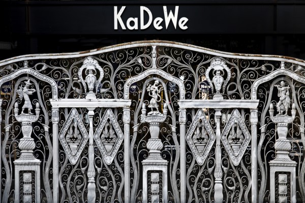 KaDeWe logo, Kaufhaus des Westens, with old forged grid in front of the entrance when the shop is closed, Charlottenburg, Berlin, Germany