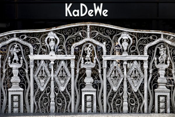 KaDeWe logo, Kaufhaus des Westens, with old forged grid in front of the entrance when the shop is closed, Charlottenburg, Berlin, Germany