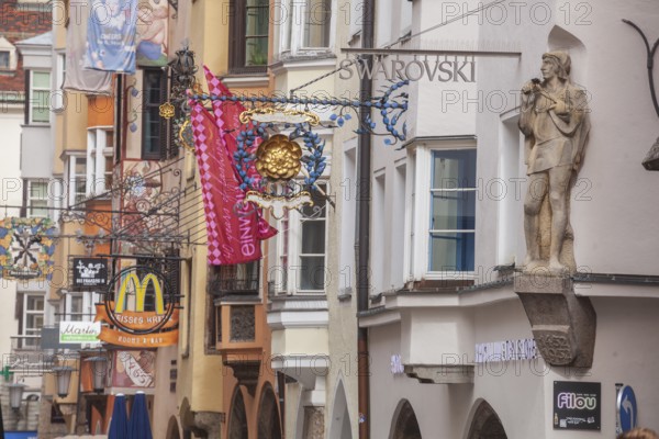 Golden roof, lots of people and historic houses in Herzog-Friedrich-Straße, Altstadt, Innsbruck, Tyrol, Austria