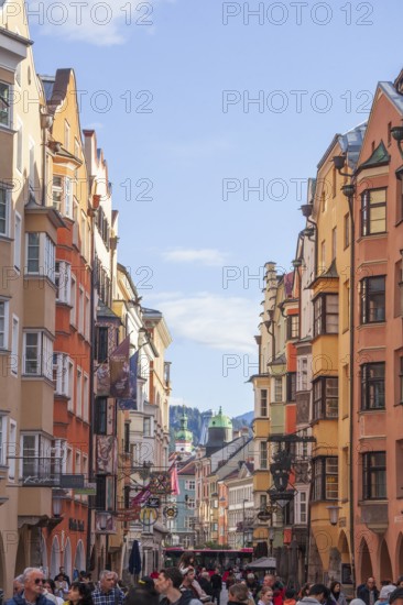 Many people and historic houses in Herzog-Friedrich-Straße, Altstadt, Innsbruck, Tyrol, Austria