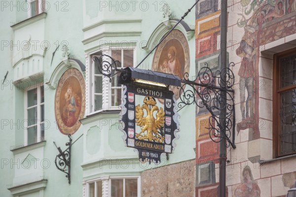 Old hanging sign from Gasthof Goldener Adler in Herzog-Friedrich-Straße, Old Town, Innsbruck, Tyrol, Austria