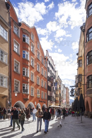 Many people and historic houses in Herzog-Friedrich-Straße, Altstadt, Innsbruck, Tyrol, Austria