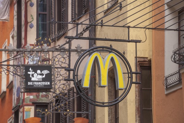 McDonald's hanging sign in Herzog-Friedrich-Straße, Altstadt, Innsbruck, Tyrol, Austria