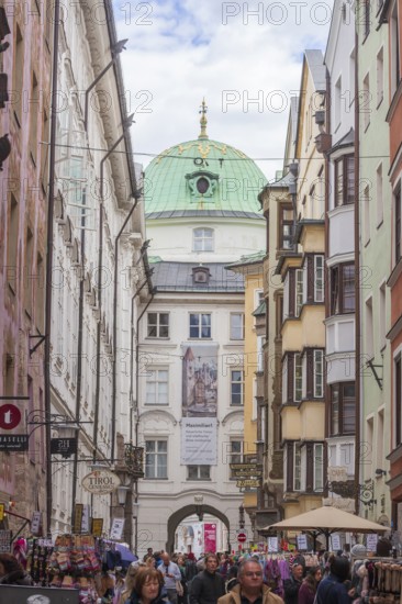 Hofgasse with Hofburg Imperial Palace, historic houses and many people, old town, Innsbruck, Tyrol, Austria