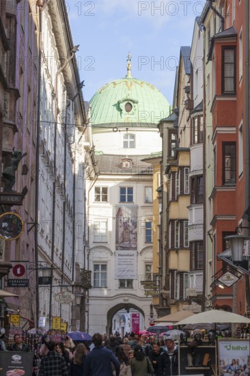 Hofgasse with Hofburg Imperial Palace, historic houses and many people, old town, Innsbruck, Tyrol, Austria
