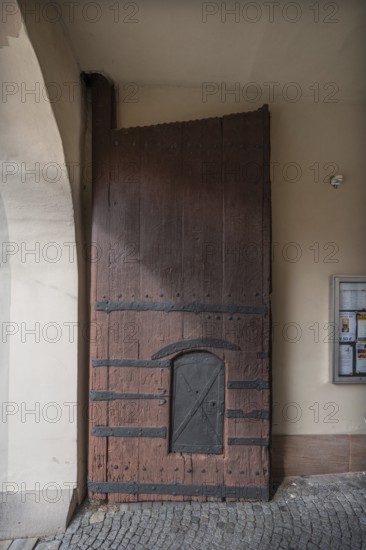 Left side of the wooden gate with manhole at the entrance to the fortified church, around 1500, Hannberg, Middle Franconia, Bavaria, Germany