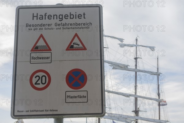 Warning of flood risk in port area, sign, special danger area, stopping ban, speed limit, 20 km/h zone, traffic sign, three-master, Baltic Sea, Kiel Fjord, Kiel, Holtenau district, Schleswig-Holstein, Germany
