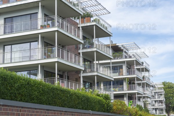 Modern buildings on the Kiel Fjord, Baltic Sea, Kiel, Holtenau district, architecture, row, balconies, windows, hedge, Schleswig-Holstein, Germany