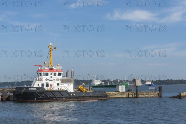 Saatsee in the harbor, multi-purpose ship of the Kiel Canal Waterways and Shipping Authority. Ships waiting for canal entrance, Baltic Sea, Kiel Fjord, Kiel, baluer sky, sunshine, Holtenau district, Schleswig-Holstein, Germany