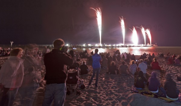 Baltic Sea in flames at Grömitz pier, fireworks, highlight of the season, end of the season, beach, spectators, beach chairs at night, shower of sparks, Baltic Sea resort, tourist attraction, Grömitz, Baltic Sea, Schleswig-Holstein, Germany, Europe, aerial photo, birds-eyes view, aerial photography, aerial photography, overview, overview, bird's-eye view