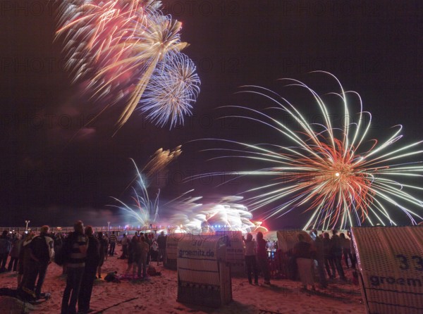 Baltic Sea in flames at Grömitz pier, fireworks, highlight of the season, end of the season, beach, spectators, beach chairs at night, shower of sparks, Baltic Sea resort, tourist attraction, Grömitz, Baltic Sea, Schleswig-Holstein, Germany, Europe, aerial photo, birds-eyes view, aerial photography, aerial photography, overview, overview, bird's-eye view