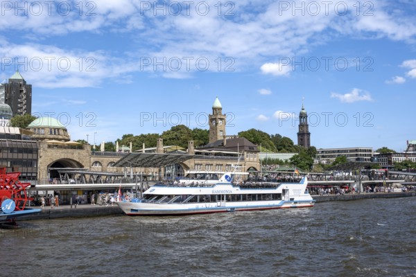Elbe and boats at St. Pauli Landungsbrücken, historic building with water level tower, Hamburg, Germany