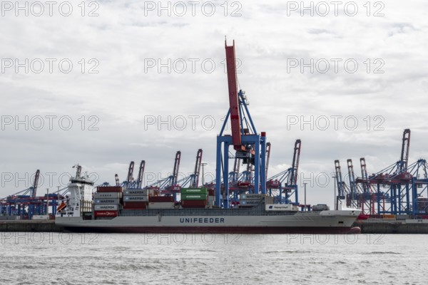 Container ship, loading cranes and stacks of containers, Port of Hamburg, container terminal, Hamburg, Germany