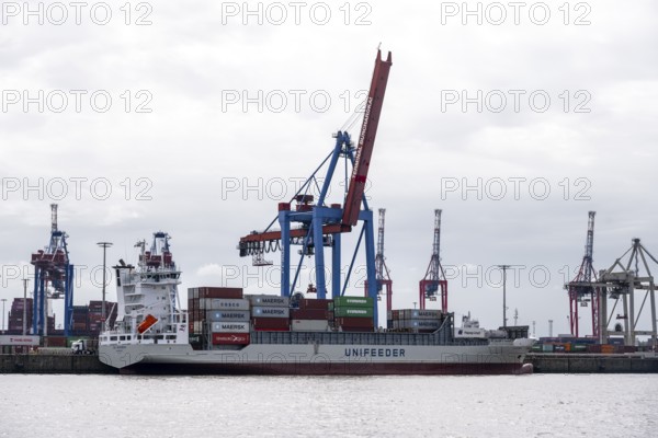 Container ship, loading cranes and stacks of containers, Port of Hamburg, container terminal, Hamburg, Germany