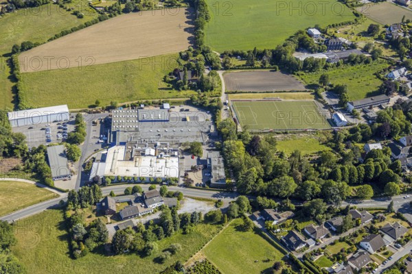 Aerial view, sports ground VfL Gennebreck 1923, Wicke GmbH, Herzkamp, Sprockhövel, Ruhr area, North Rhine-Westphalia, Germany, business-to-business service, DE, Ennepe-Ruhr district, Europe, commercial enterprises, commercial area, commercial site, commercial use, industrial area, industrial site, aerial photograph, aerial photography, aerial photography, overview, bird's-eye view, bird's-eye view, industrial wheels, overview