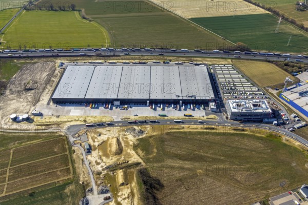 Aerial view, new construction Woolworth headquarters and logistics centre, commercial area Unna Kamen, Unna, Ruhr area, North Rhine-Westphalia, Germany, DE, Europe, commercial enterprises, commercial area, commercial park, commercial location, commercial use, freight traffic, industrial area, industrial location, logistics, logistics centre, aerial photograph, aerial photography, aerial photography, overview, bird's-eye view, bird's-eye view, overview