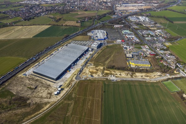 Aerial view, new Woolworth headquarters and logistics centre, commercial area Unna Kamen, Ikea, Unna, Ruhr area, North Rhine-Westphalia, Germany, A1 motorway, DE, Europe, commercial enterprises, commercial area, commercial park, commercial location, commercial use, freight traffic, industrial area, industrial location, logistics, logistics centre, aerial view, aerial photography, aerial photography, overview, bird's-eye view, overview
