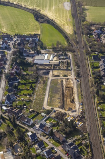 Aerial view, Drücke Garten-Zentrum Unna, construction area residential buildings, former sports field, Steinstraße, Unna, Ruhr area, North Rhine-Westphalia, Germany, railway tracks, construction work, construction area, building site, building plots, construction project, construction site, DE, development, Europe, property tax, real estate, capacity requirements, aerial view, aerial photography, aerial photography, new construction, overview, bird's-eye view, housing estate, housing and living, residential area, residential buildings, residential quality, residential neighbourhood, housing estate, birds-eyes view, overview