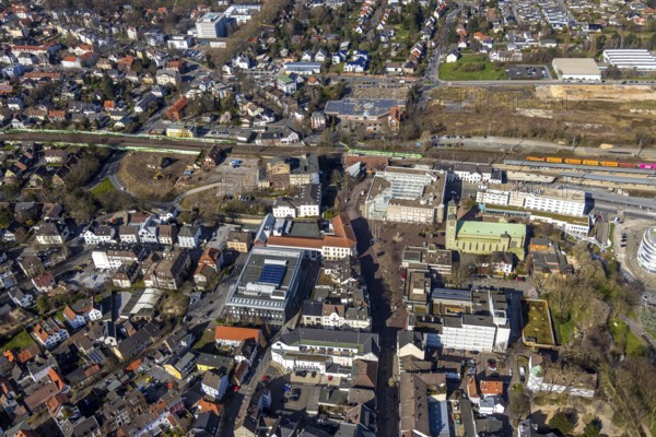 Aerial view, Unna railway station, Viktoriastrasse construction area for office building, St. Catherine's Catholic Church, Unna town hall, Unna, Ruhr area, North Rhine-Westphalia, Germany. Katharina, Unna town hall, Unna, Ruhr area, North Rhine-Westphalia, Germany, place of worship, railway station, Bahnhofstraße, station forecourt, construction area, building site, building plots, construction project, construction site, authority, bus station, container train, DE, Deutsche Bahn AG, development, Europe, religious community, house of worship, capacity requirement, church, parish, denomination, aerial view, aerial photography, aerial photography, new building, town hall, town hall square, religion, suburban railway, city administration, overview, administrative area, bird's-eye view, birds-eyes view, former Hildebrand plough factory, overview
