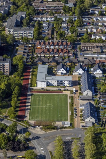 Aerial view, sports field Enkircher Weg, terraced houses, Unna, Ruhr area, North Rhine-Westphalia, Germany, DE, Europe, football pitch, football stadium, property tax, real estate, aerial photography, aerial photography, sports facilities, sports field, sports facility, overview, bird's eye view, residential complex, living and living, residential area, residential buildings, residential quality, residential neighbourhood, housing estate, birds-eyes view, overview