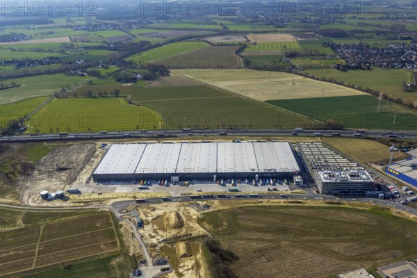 Aerial view, new Woolworth headquarters and logistics centre, Unna Kamen business park, Unna, Ruhr area, North Rhine-Westphalia, Germany, A1 motorway, DE, Europe, commercial enterprises, commercial area, business park, commercial location, commercial use, freight traffic, industrial area, industrial location, logistics, logistics centre, aerial view, aerial photography, aerial photography, overview, bird's-eye view, meadows and fields, bird's-eye view, overview