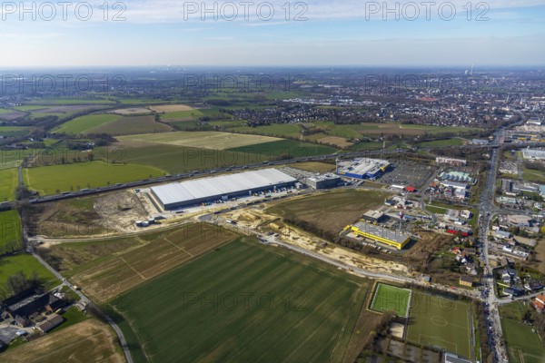 Aerial view, new Woolworth headquarters and logistics centre, commercial area Unna Kamen, Ikea, Unna, Ruhr area, North Rhine-Westphalia, Germany, A1 motorway, DE, Europe, commercial enterprises, commercial area, commercial park, commercial location, commercial use, freight traffic, industrial area, industrial location, logistics, logistics centre, aerial view, aerial photography, aerial photography, overview, bird's-eye view, meadows and fields, birds-eyes view, overview