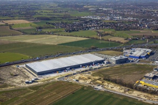 Aerial view, new Woolworth headquarters and logistics centre, commercial area Unna Kamen, Ikea, Unna, Ruhr area, North Rhine-Westphalia, Germany, A1 motorway, DE, Europe, commercial enterprises, commercial area, commercial park, commercial location, commercial use, freight traffic, industrial area, industrial location, logistics, logistics centre, aerial view, aerial photography, aerial photography, overview, bird's-eye view, meadows and fields, birds-eyes view, overview