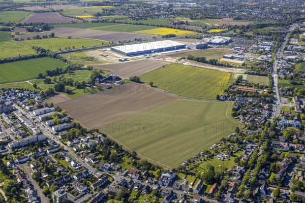 Aerial view, new Woolworth headquarters and logistics centre, commercial area Unna Kamen, Ikea furniture store, Unna, Ruhr area, North Rhine-Westphalia, Germany, A1 motorway, DE, Europe, commercial enterprises, commercial area, commercial park, commercial location, commercial use, freight traffic, industrial area, industrial location, logistics, logistics centre, aerial view, aerial photography, aerial photography, overview, bird's-eye view, meadows and fields, birds-eyes view, overview