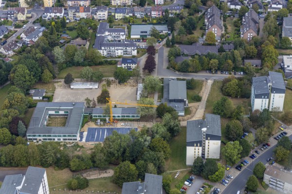 Aerial view, construction site Gerhart-Hauptmann-Schule, Städt. Community primary school, Kostenberg, Velbert, Ruhr area, North Rhine-Westphalia, Germany, Bartelskamp, construction work, construction, construction area, construction site, building plots, construction crane, construction project, construction site, education, educational institution, DE, Europe, primary school, teaching institute, aerial view, aerial photography, aerial photography, school, overview, bird's-eye view, birds-eyes view, onlyVelbert, overview, Velbert-Mitte