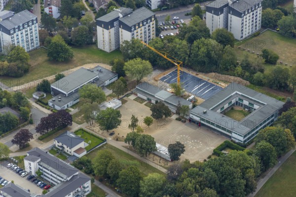 Aerial view, construction site Gerhart-Hauptmann-Schule, Städt. Community primary school, Kostenberg, Velbert, Ruhr area, North Rhine-Westphalia, Germany, Bartelskamp, construction work, construction, construction area, construction site, building plots, construction crane, construction project, construction site, education, educational institution, DE, Europe, primary school, teaching institute, aerial view, aerial photography, aerial photography, school, overview, bird's-eye view, birds-eyes view, onlyVelbert, overview, Velbert-Mitte