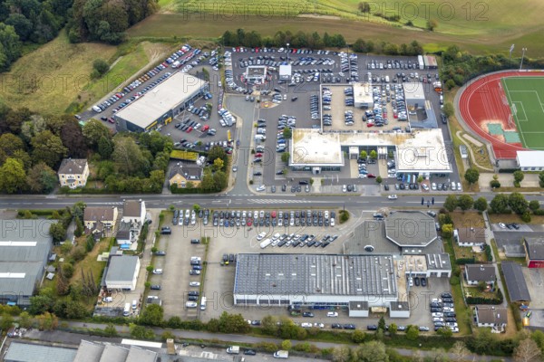 Aerial view, Am Sportplatz Allgemeiner Sportverein Tönisheide, industrial area Nevigeser Straße, Volkswagen Gottfried Schultz Automobilhandel, PanoramaRadweg Niederbergbahn, Neviges, Velbert, Ruhr area, North Rhine-Westphalia, Germany, DE, Europe, commercial enterprises, commercial area, commercial area, commercial park, commercial location, commercial use, Günter-Kratz-Weg, industrial area, industrial location, aerial view, aerial photography, aerial photography, cycle path, stadium, overview, bird's-eye view, birds-eyes view, onlyVelbert, overview, Velbert-Mitte