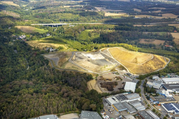 Aerial view, overburden dump Zechenweg, Hefel, industrial area Röbbeck, Stahlstraße, Röbbeck, Velbert, Ruhr area, North Rhine-Westphalia, Germany, overburden dump, motorway A44, motorway bridge, bridge, DE, Europe, distant view, commercial enterprises, commercial area, commercial area, commercial park, commercial site, commercial use, Hesperbach, industrial area, industrial site, aerial view, aerial photography, aerial photography, nature reserve, overview, bird's-eye view, forest area, birds-eyes view, onlyVelbert, overview, Velbert-Mitte