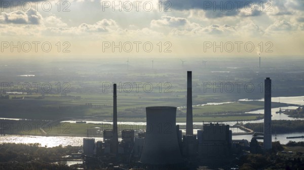 Aerial view, former power plant Voerde in backlight, Frankfurter Straße, river Rhine, shipping, Möllen, Voerde, Ruhr area, North Rhine-Westphalia, Germany, inland navigation, view to Voerde, DE, haze, emission environment, energy, energy supplier, Europe, commercial use, freight transport, freight traffic, industrial plants, industrial site, coal-fired power station, power station, power station Voerde, logistics, aerial view, aerial photography, aerial photography, Lower Rhine, ship, ship traffic, coal-fired power station, overview, bird's-eye view, WTG, forest area, wind energy, wind energy plant, wind power, wind turbine, wind turbines, birds-eyes view, overview, decommissioned