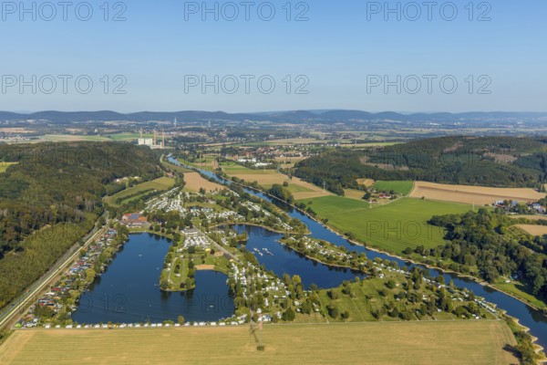 Aerial photo, family campsite Borlefzen, river Weser, Uffeln, Vlotho, OWL, Ostwestfalen-Lippe, East Westphalia, North Rhine-Westphalia, Germany, bathing lake, boats, boat harbour, Borlefzener Hof, camping, camping facility, camping houses, camping mobile, camping site, DE, Europe, distant view, leisure, hobby, Veltheim power station, aerial view, aerial photography, aerial photography, OWL book, OWL book, lake, sailing boats, overview, bird's-eye view, motorhome, caravan, marina, birds-eyes view, overview, decommissioned power station
