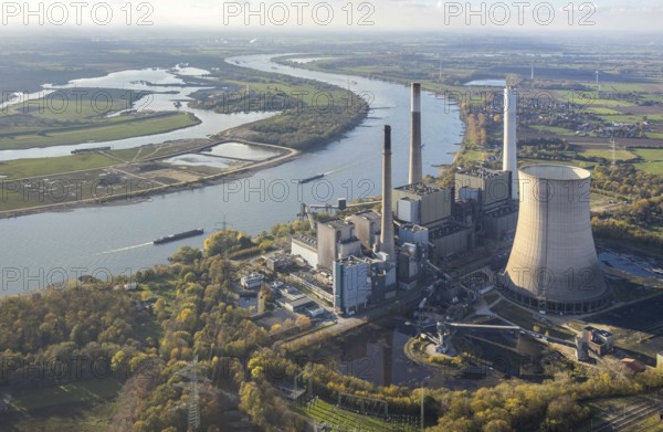 Aerial view, former power plant Voerde, Frankfurter Straße, river Rhine, navigation, Möllen, Voerde, Ruhr area, North Rhine-Westphalia, Germany, inland navigation, view to Voerde, DE, emission environment, energy, energy supplier, Europe, commercial use, freight transport, freight transport, industrial plants, industrial site, coal-fired power station, power station, power station Voerde, logistics, aerial view, aerial photography, aerial photography, Lower Rhine, production plants, production halls, ship, shipping traffic, coal-fired power station, electricity, overview, bird's-eye view, forest area, birds-eyes view, overview, decommissioned