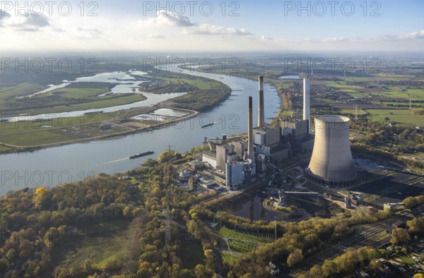Aerial view, former power plant Voerde, Frankfurter Straße, river Rhine, navigation, Möllen, Voerde, Ruhr area, North Rhine-Westphalia, Germany, inland navigation, view to Voerde, DE, emission environment, energy, energy supplier, Europe, commercial use, freight transport, freight transport, industrial plants, industrial site, coal-fired power station, power station, power station Voerde, logistics, aerial view, aerial photography, aerial photography, Lower Rhine, production plants, production halls, ship, shipping traffic, coal-fired power station, electricity, overview, bird's-eye view, forest area, birds-eyes view, overview, decommissioned