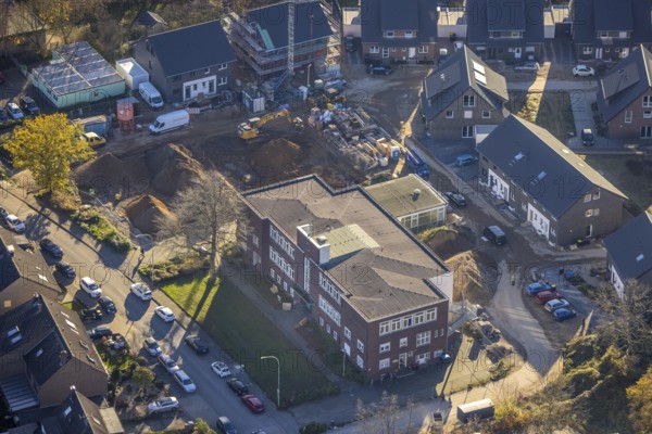 Aerial view, VHS Neukirchen-Vluyn, construction site, new building, residential area, Vluyn, Neukirchen-Vluyn, Ruhr area, North Rhine-Westphalia, Germany, construction work, building, construction area, building site, building plots, construction project, construction site, DE, Diesterwegstraße, Europe, property tax, real estate, aerial view, aerial photography, aerial photography, new construction, overview, bird's-eye view, housing estate, residential area, residential buildings, residential quality, residential neighbourhood, housing estate, birds-eyes view, overview