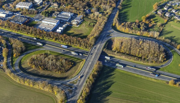 Aerial view, motorway A40, junction Neukirchen-Vluyn, commercial area Lintorfer Straße, Neukirchen, Neukirchen-Vluyn, Ruhr area, North Rhine-Westphalia, Germany, motorway junction, DE, Europe, commercial enterprises, commercial area, commercial park, commercial location, commercial use, industrial area, industrial building, industrial location, aerial view, aerial photography, aerial photography, overview, bird's-eye view, overview