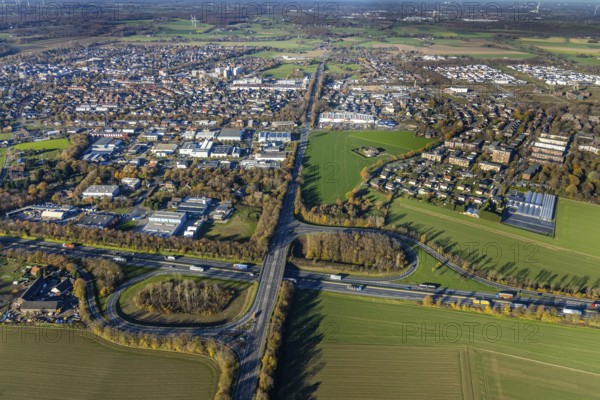 Aerial view, motorway A40, junction Neukirchen-Vluyn, commercial area Lintorfer Straße, Neukirchen, Neukirchen-Vluyn, Ruhr area, North Rhine-Westphalia, Germany, motorway junction, DE, Europe, commercial enterprises, commercial area, commercial park, commercial location, commercial use, industrial area, industrial building, industrial location, aerial view, aerial photography, aerial photography, overview, bird's-eye view, overview