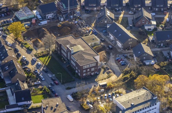 Aerial view, VHS Neukirchen-Vluyn, construction site, new building, residential area, Vluyn, Neukirchen-Vluyn, Ruhr area, North Rhine-Westphalia, Germany, construction work, building, construction area, building site, building plots, construction project, construction site, DE, Diesterwegstraße, Europe, property tax, real estate, aerial view, aerial photography, aerial photography, new construction, overview, bird's-eye view, housing estate, residential area, residential buildings, residential quality, residential neighbourhood, housing estate, birds-eyes view, overview