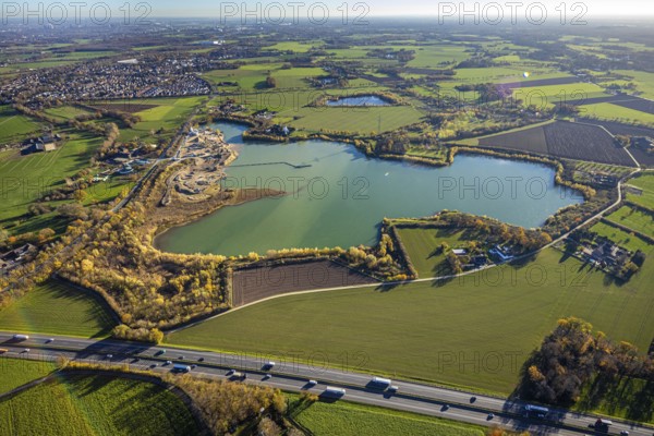 Aerial view, Krefelder Straße quarry pond, meadows and fields, Neukirchen, Neukirchen-Vluyn, Ruhr area, North Rhine-Westphalia, Germany, An der Neuen Mühle, motorway A40, Carl Risch GmbH, DE, Europe, aerial view, aerial photography, aerial photography, mill, lake, overview, bird's-eye view, overview